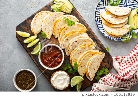 Baked tacos with pulled chicken and cheese Baked tacos with pulled chicken and cheese 106112939