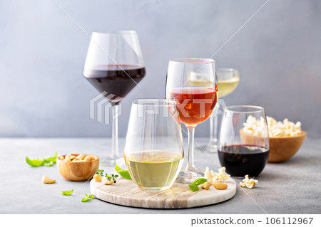 Red, white wine and rose in different glasses Red, white wine and rose in different glasses 106112967