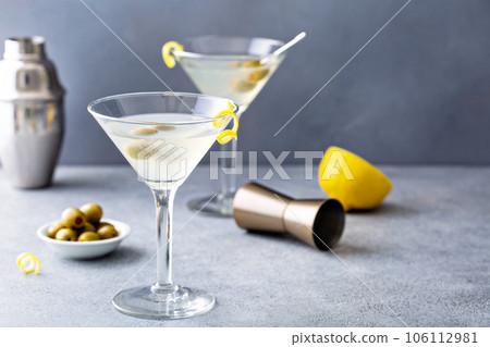 Classic lemon drop martini with olives and lemon 106112981