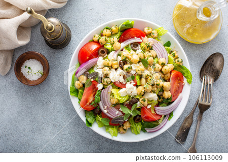 Healthy spring Greek salad with fresh vegetables and chickpeas Healthy spring Greek salad with fresh vegetables and chickpeas 106113009