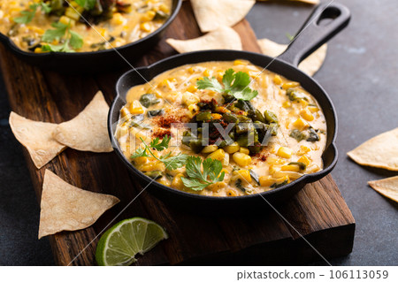 Grilled poblano and corn dip with tortilla chips Grilled poblano and corn dip with tortilla chips 106113059