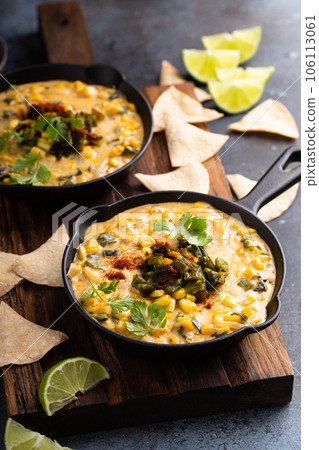 Grilled poblano and corn dip with tortilla chips Grilled poblano and corn dip with tortilla chips 106113061