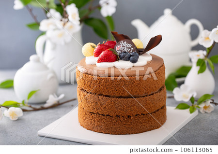 Chocolate cake for Mother's day with berries and chocolate topping 106113065