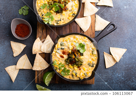 Grilled poblano and corn dip with tortilla chips Grilled poblano and corn dip with tortilla chips 106113067