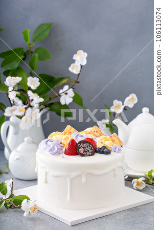 Vanilla cake for Mother's day with flowers and white chocolate glaze Vanilla cake for Mother's day with flowers and white chocolate glaze 106113074