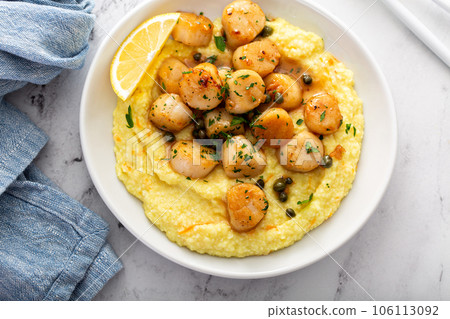Seared scallops with grits Seared scallops with grits 106113092