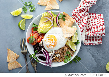 Breakfast burrito bowl with pork carnitas and rice 106113095