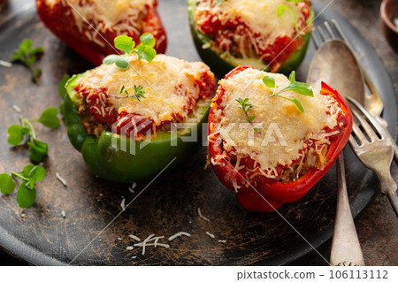 Stuffed peppers with ground beef filling on a plate 106113112