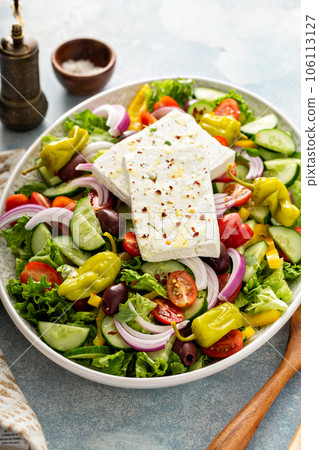Greek salad with feta on a large platter 106113127