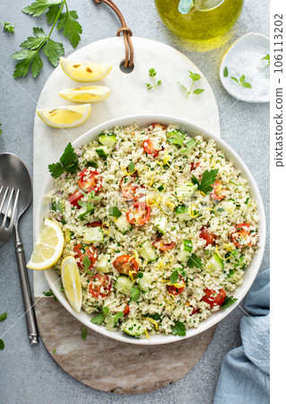 Tabbouleh salad with cauliflower rice and vegetables 106113202
