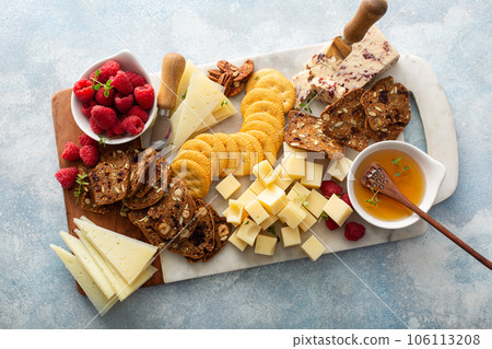 Cheese board or snack board with crackers Cheese board or snack board with crackers 106113208