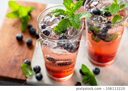 Blueberry mojito in tall glasses with mint Blueberry mojito in tall glasses with mint 106113220