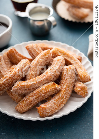 Homemade churros with cinnamon sugar on a plate Homemade churros with cinnamon sugar on a plate 106113246