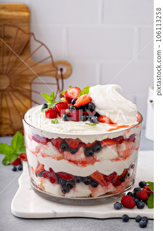 Summer berry trifle with angel food cake in a large bowl 106113258