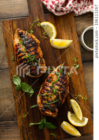 Balsamic grilled chicken breast on a board Balsamic grilled chicken breast on a board 106113267