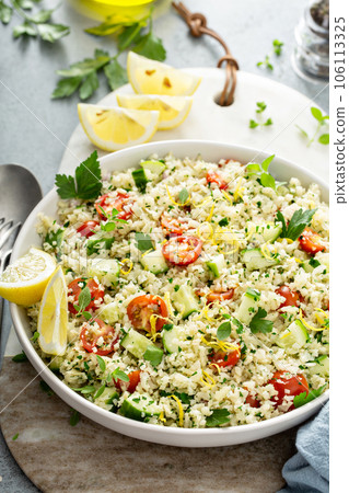 Tabbouleh salad with cauliflower rice and vegetables Tabbouleh salad with cauliflower rice and vegetables 106113325