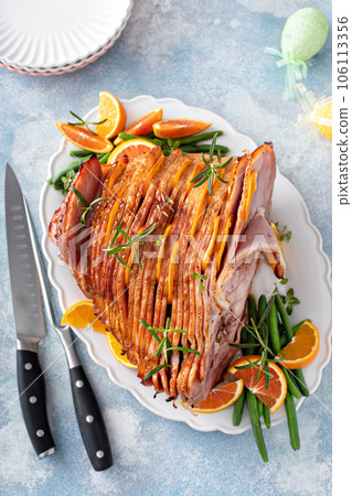 Traditional Easter ham with orange honey glaze Traditional Easter ham with orange honey glaze 106113356