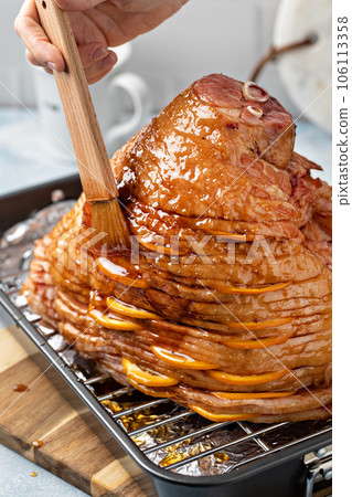 Making Easter or Christmas ham with honey orange glaze Making Easter or Christmas ham with honey orange glaze 106113358