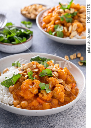 Vegan curry with cauliflower, chickpeas and butternut squash Vegan curry with cauliflower, chickpeas and butternut squash 106113378