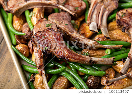 Grilled or roasted lamb chops with green beans and potatoes Grilled or roasted lamb chops with green beans and potatoes 106113407