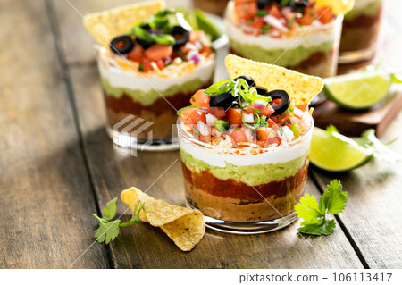 Seven layer dip in individual cups, mexican appetizer Seven layer dip in individual cups, mexican appetizer 106113417