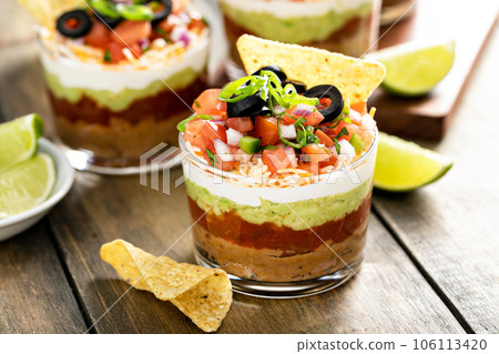 Seven layer dip in individual cups, mexican appetizer 106113420