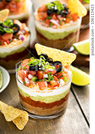 Seven layer dip in individual cups, mexican appetizer Seven layer dip in individual cups, mexican appetizer 106113423