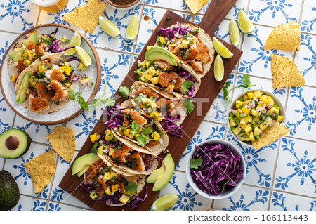 Fish tacos with mango salsa and red cabbage Fish tacos with mango salsa and red cabbage 106113443