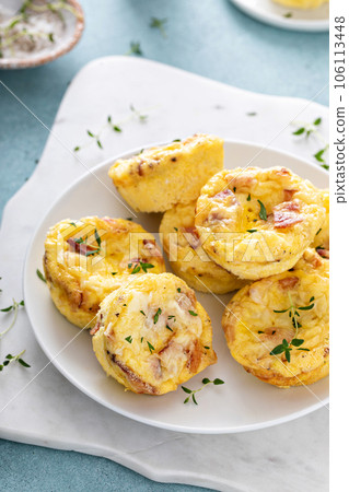 Bacon and cheddar egg muffins for breakfast Bacon and cheddar egg muffins for breakfast 106113448