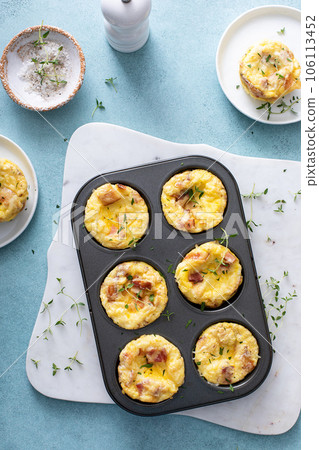 Bacon and cheddar egg muffins for breakfast Bacon and cheddar egg muffins for breakfast 106113452