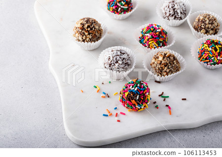Homemade chocolate truffles covered with sprinkles and nuts 106113453