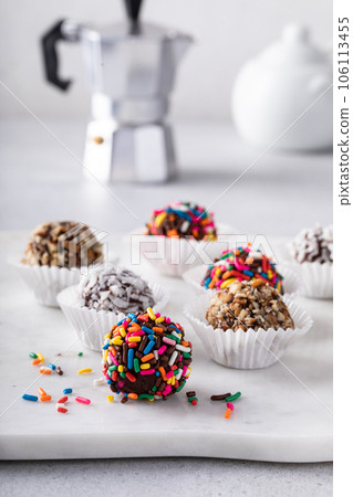 Homemade chocolate truffles covered with sprinkles and nuts Homemade chocolate truffles covered with sprinkles and nuts 106113455