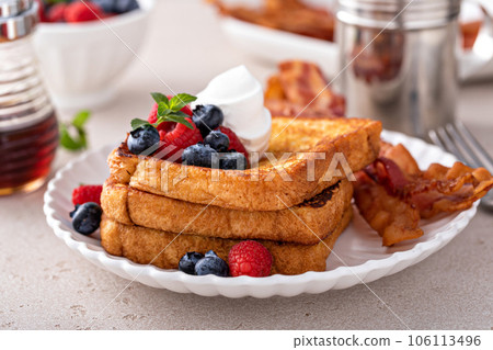 Classic french toast with bacon and berries Classic french toast with bacon and berries 106113496
