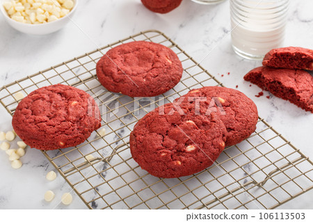 Red velvet cookies with white chocolate chips with milk 106113503