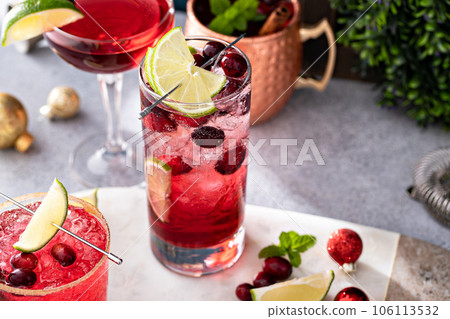 Variety of festive Christmas cocktails with cranberry and lime Variety of festive Christmas cocktails with cranberry and lime 106113532