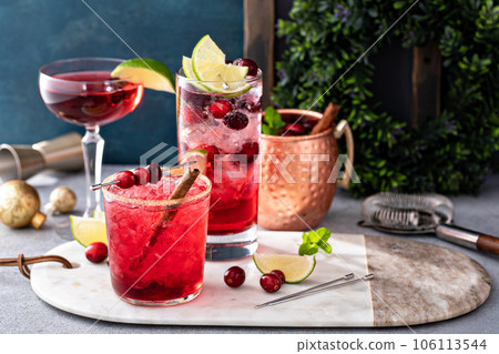 Variety of festive Christmas cocktails with cranberry and lime Variety of festive Christmas cocktails with cranberry and lime 106113544