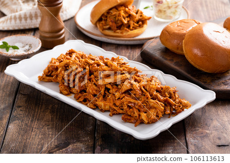 Pulled bbq chicken on a serving plate Pulled bbq chicken on a serving plate 106113613