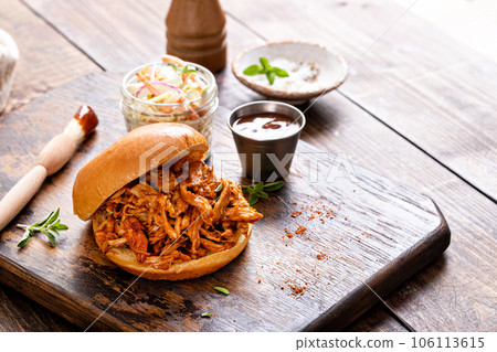 Pulled bbq chicken on a brioche bun Pulled bbq chicken on a brioche bun 106113615