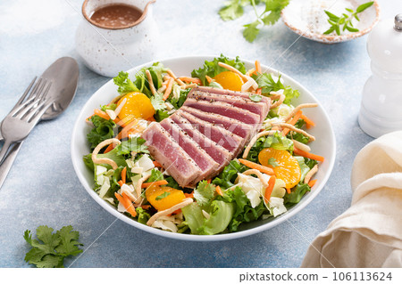Seared tuna with asian crunchy salad with oranges Seared tuna with asian crunchy salad with oranges 106113624