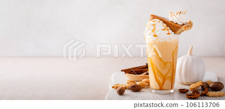 Pumpkin pie milkshake with caramel syrup and whipped cream 106113706