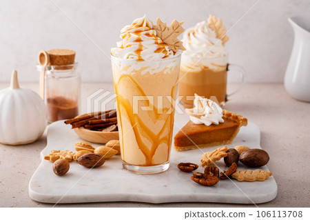 Pumpkin pie milkshake with caramel syrup and whipped cream 106113708