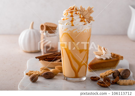Pumpkin pie milkshake with caramel syrup and whipped cream Pumpkin pie milkshake with caramel syrup and whipped cream 106113712