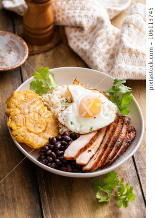 Caribbean or latin american breakfast with rice, beans and pork 106113745