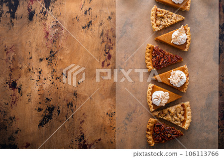 Traditional fall Thanksgiving pie slices, pumpkin and pecan pie 106113766