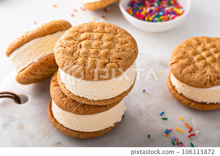 Ice cream and cookies sandwiches stacked on the table 106113872