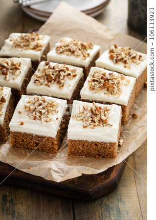 Carrot or spice cake with cream cheese frosting 106113921