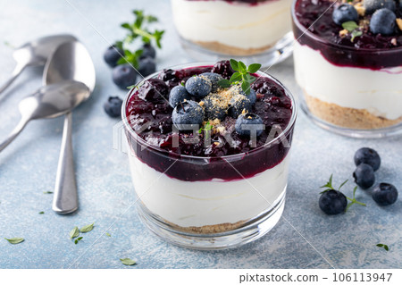 Blueberry cheesecake in a jar with graham cracker base Blueberry cheesecake in a jar with graham cracker base 106113947