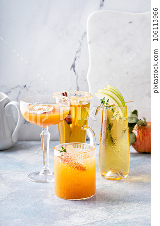 Variety of fall cocktails or mocktails made with apple cider Variety of fall cocktails or mocktails made with apple cider 106113966