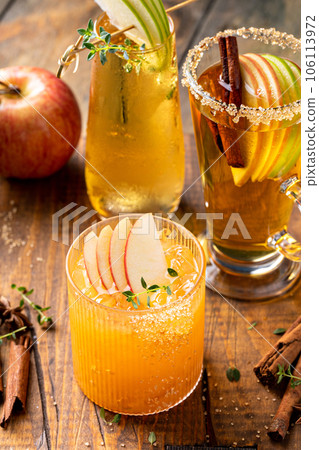 Variety of fall cocktails or mocktails made with apple cider Variety of fall cocktails or mocktails made with apple cider 106113972