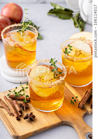Hard apple cider cocktail with cinnamon and thyme, fall drink Hard apple cider cocktail with cinnamon and thyme, fall drink 106114017